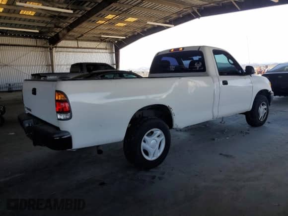 2002 Toyota Tundra z VIN 5TBJN32142S303241, wystawiony jako Copart lot #64789225 z przebiegiem 216 962 mil mil oraz Czysty tytuł • Clean title. Historia ofert i sprzedaży dostępna na DreamBid. Obrazek 3.