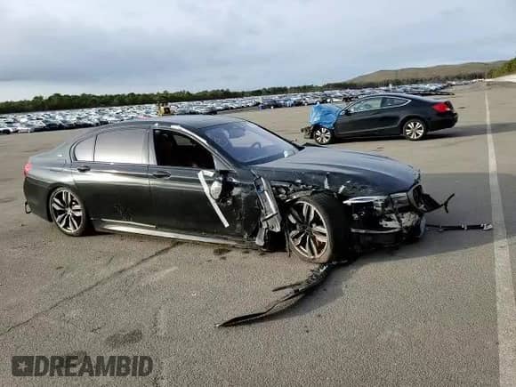 2018 BMW 7 Series M760i xDrive с VIN WBA7H6C53JG614984, выставлен на аукционе Copart как лот 73671322 с пробегом 28 191 миль миль и . История ставок и продаж доступна на DreamBid. Изображение 11.