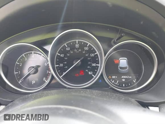 2022 Mazda CX-5 S Carbon Edition z VIN JM3KFBCM3N0551653, wystawiony jako IAAI lot #41495011 z przebiegiem 49 842 mil mil oraz . Historia ofert i sprzedaży dostępna na DreamBid. Obrazek 7.