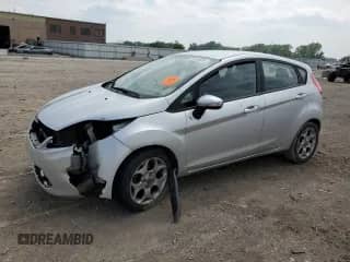 2012 Ford Fiesta SES with VIN 3FADP4FJ3CM173961, listed as a Copart auction lot 59742935 with Not provided miles and Salvage title. Bid and sale history available at DreamBid. Image 1.