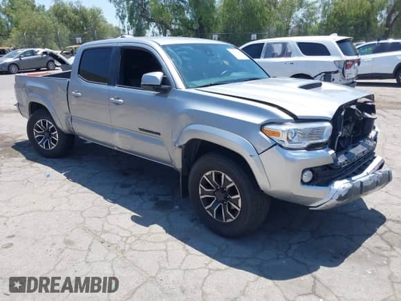 2020 Toyota Tacoma SR5 z VIN 3TMBZ5DN3LM025980, wystawiony jako IAAI lot #42215140 z przebiegiem 67 414 mil mil oraz . Historia ofert i sprzedaży dostępna na DreamBid. Obrazek 1.