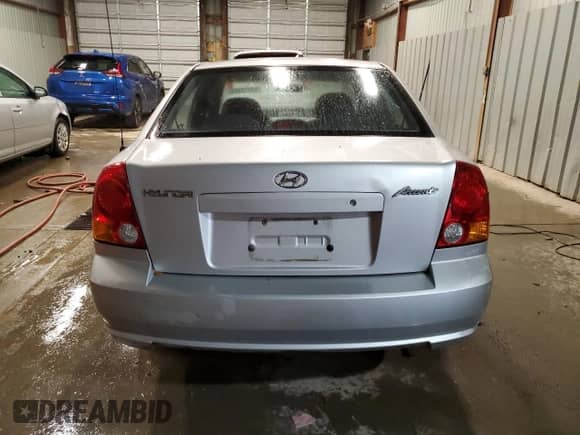 2004 Hyundai Accent GL z VIN KMHCG45C04U544804, wystawiony jako Copart lot #72912984 z przebiegiem 121 178 mil mil oraz Szkoda całkowita • Salvage title. Historia ofert i sprzedaży dostępna na DreamBid. Obrazek 6.