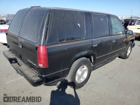 2000 Chevrolet Tahoe Limited z VIN 1GNEC13R7YR221297, wystawiony jako Copart lot #75504254 z przebiegiem 246 714 mil mil oraz Czysty tytuł • Clean title. Historia ofert i sprzedaży dostępna na DreamBid. Obrazek 3.