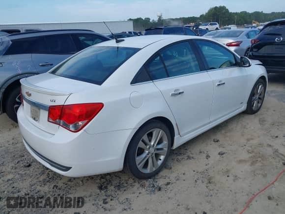 2013 Chevrolet Cruze LTZ z VIN 1G1PG5SB7D7224670, wystawiony jako IAAI lot #42814171 z przebiegiem 189 170 mil mil oraz . Historia ofert i sprzedaży dostępna na DreamBid. Obrazek 4.