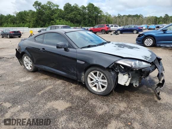 2007 Hyundai Tiburon GS с VIN KMHHM66DX7U250719, выставлен на аукционе Copart как лот 64951335 с пробегом 208 422 миль миль и Списание • Salvage title. История ставок и продаж доступна на DreamBid. Изображение 4.