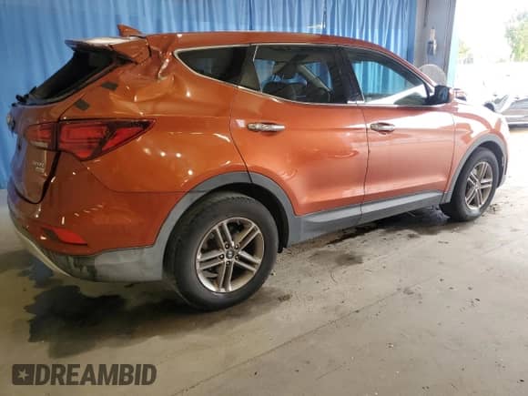 2017 Hyundai Santa Fe 2.4L z VIN 5XYZTDLB4HG464448, wystawiony jako Copart lot #85785355 z przebiegiem 144 706 mil mil oraz Szkoda całkowita • Salvage title. Historia ofert i sprzedaży dostępna na DreamBid. Obrazek 3.