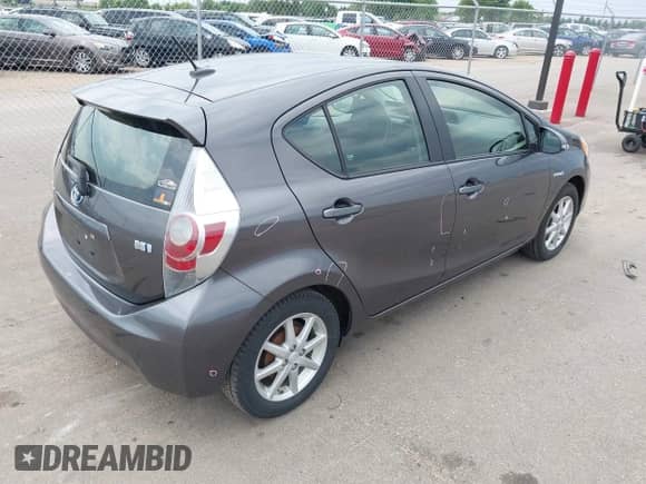 2014 Toyota Prius One with VIN JTDKDTB31E1570290, listed as a IAAI auction lot 42441474 with 164,068 mi miles and . Bid and sale history available at DreamBid. Image 4.