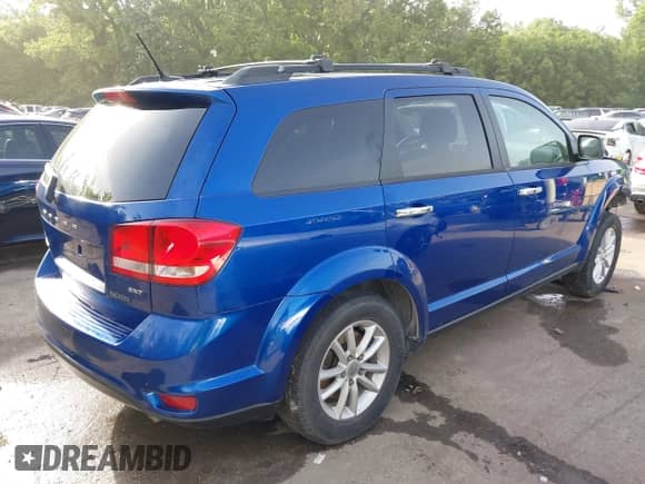 2015 Dodge Journey SXT with VIN 3C4PDDBGXFT574556, listed as a IAAI auction lot 42258095 with 214,267 mi miles and . Bid and sale history available at DreamBid. Image 4.
