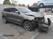 2012 Jeep Grand Cherokee SRT-8 z VIN 1C4RJFDJ8CC112350, wystawiony jako IAAI lot #42995991 z przebiegiem 210 738 mil mil oraz . Historia ofert i sprzedaży dostępna na DreamBid. Obrazek 1.