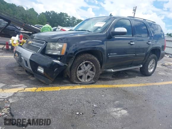 2007 Chevrolet Tahoe LT with VIN 1GNFC13037R423235, listed as a IAAI auction lot 42992915 with 148,780 mi miles and . Bid and sale history available at DreamBid. Image 17.