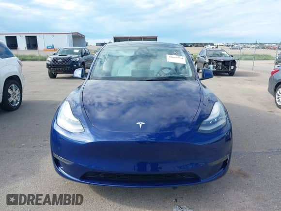2021 Tesla Model Y Long Range with VIN 5YJYGDEE8MF187196, listed as a IAAI auction lot 42615790 with 89,810 mi miles and . Bid and sale history available at DreamBid. Image 11.
