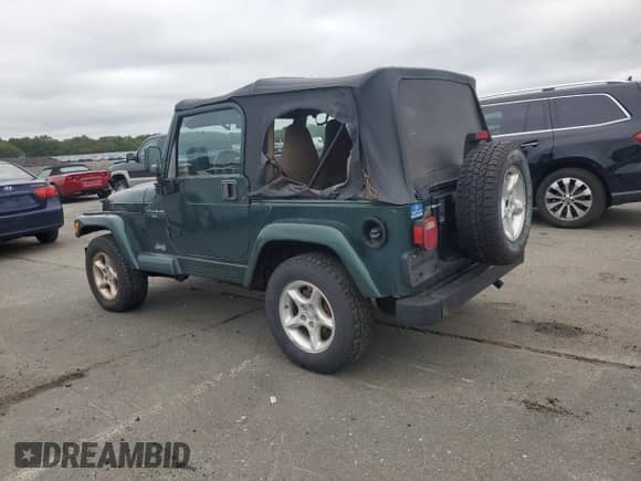2001 Jeep Wrangler Sahara z VIN 1J4FA59S21P349009, wystawiony jako Copart lot #64310995 z przebiegiem 87 642 mil mil oraz Czysty tytuł • Clean title. Historia ofert i sprzedaży dostępna na DreamBid. Obrazek 2.
