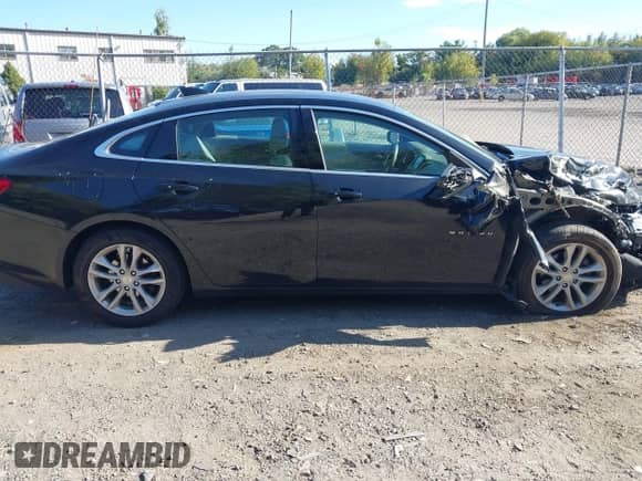 2018 Chevrolet Malibu LT z VIN 1G1ZD5ST7JF145740, wystawiony jako IAAI lot #43370388 z przebiegiem 94 051 mil mil oraz . Historia ofert i sprzedaży dostępna na DreamBid. Obrazek 13.