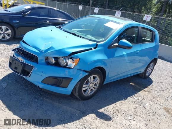 2014 Chevrolet Sonic LT with VIN 1G1JC6SBXE4157220, listed as a IAAI auction lot 42728931 with 76,007 mi miles and . Bid and sale history available at DreamBid. Image 2.