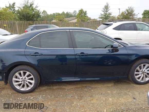 2021 Toyota Camry LE with VIN 4T1C11AK8MU548158, listed as a IAAI auction lot 43333222 with 34,824 mi miles and . Bid and sale history available at DreamBid. Image 14.