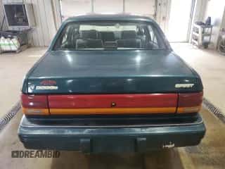 1994 Dodge Spirit z VIN 3B3AA4638RT310022, wystawiony jako Copart lot #63479515 z przebiegiem 157 435 mil mil oraz Szkoda całkowita • Salvage title. Historia ofert i sprzedaży dostępna na DreamBid. Obrazek 6.