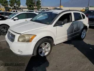 2010 Dodge Caliber SXT with VIN 1B3CB4HA3AD595658, listed as a Copart auction lot 85376495 with 209,626 mi miles and Salvage title. Bid and sale history available at DreamBid. Image 1.