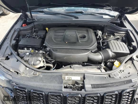 2019 Jeep Grand Cherokee Laredo E with VIN 1C4RJFAG2KC834260, listed as a Copart auction lot 64800465 with 102,520 mi miles and Salvage title. Bid and sale history available at DreamBid. Image 12.