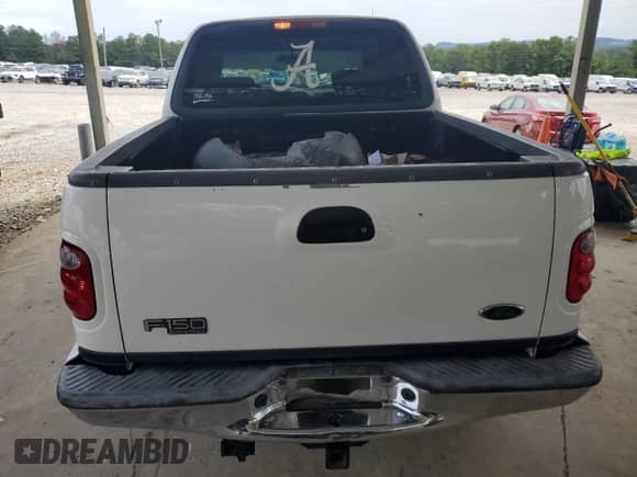 2002 Ford F-150 XLT with VIN 1FTRW07L42KB41425, listed as a Copart auction lot 69473745 with Not provided miles and Salvage title. Bid and sale history available at DreamBid. Image 6.