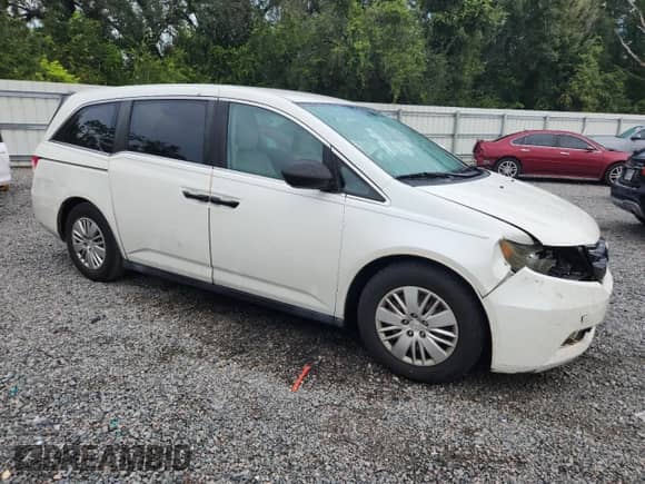 2015 Honda Odyssey LX with VIN 5FNRL5H20FB008529, listed as a Copart auction lot 81084685 with 128,269 mi miles and Salvage title. Bid and sale history available at DreamBid. Image 4.