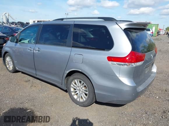2012 Toyota Sienna XLE with VIN 5TDYK3DCXCS235154, listed as a IAAI auction lot 43366877 with 216,434 mi miles and . Bid and sale history available at DreamBid. Image 3.