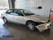 2000 Saturn SL with VIN 1G8ZK5271YZ182706, listed as a Copart auction lot 70810135 with 180,566 mi miles and Salvage title. Bid and sale history available at DreamBid. Image 4.