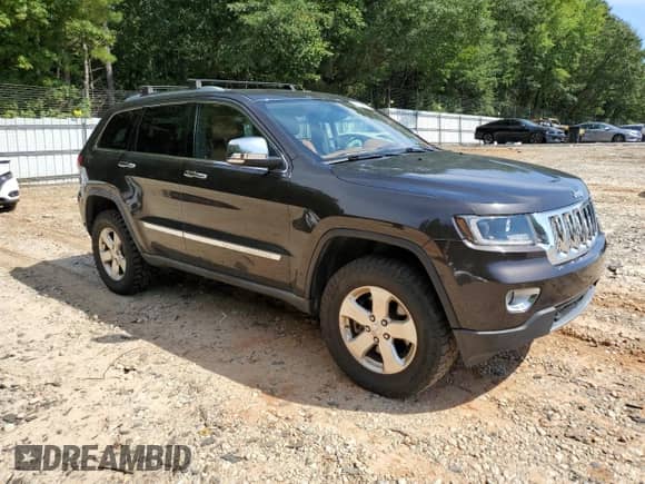 2012 Jeep Grand Cherokee Overland Summit z VIN 1C4RJFCT9CC182149, wystawiony jako Copart lot #70084615 z przebiegiem 199 715 mil mil oraz Szkoda całkowita • Salvage title. Historia ofert i sprzedaży dostępna na DreamBid. Obrazek 4.