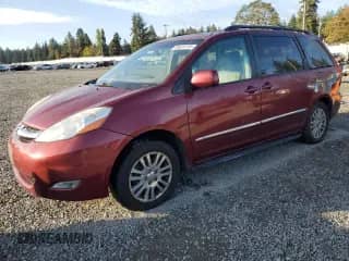 2010 Toyota Sienna XLE with VIN 5TDDK4CC2AS031404, listed as a Copart auction lot 86620735 with 228,754 mi miles and Salvage title. Bid and sale history available at DreamBid. Image 1.