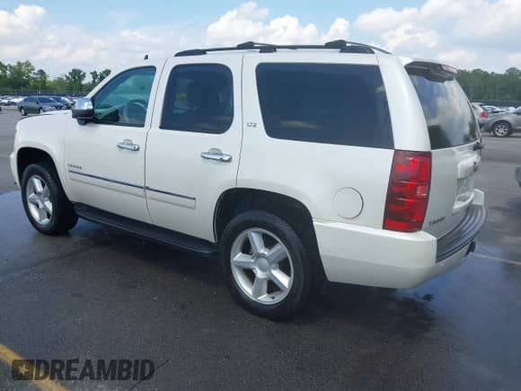 2011 Chevrolet Tahoe LTZ with VIN 1GNSCCE09BR248960, listed as a IAAI auction lot 42869086 with 240,413 mi miles and . Bid and sale history available at DreamBid. Image 3.