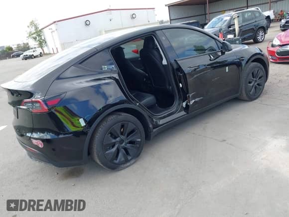 2024 Tesla Model Y with VIN 7SAYGDED8RF156984, listed as a IAAI auction lot 43324819 with 26,941 mi miles and . Bid and sale history available at DreamBid. Image 4.