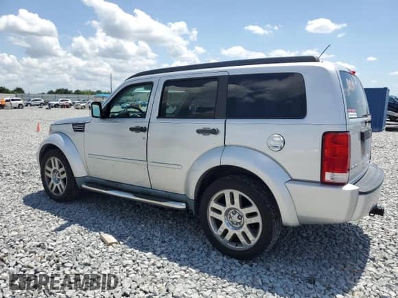2011 Dodge Nitro Heat with VIN 1D4PT4GK5BW605204, listed as a Copart auction lot 52677235 with 104,039 mi miles and Salvage title. Bid and sale history available at DreamBid. Image 2.
