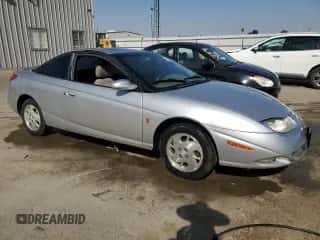 2002 Saturn SC с VIN 1G8ZY12712Z186012, выставлен на аукционе Copart как лот 68756684 с пробегом 140 205 миль миль и Чистый • Clean title. История ставок и продаж доступна на DreamBid. Изображение 4.