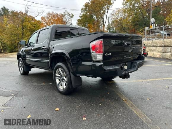 2017 Toyota Tacoma Limited with VIN 3TMGZ5AN1HM076847, listed as a Copart auction lot 90890025 with 157,366 mi miles and Clean title. Bid and sale history available at DreamBid. Image 2.