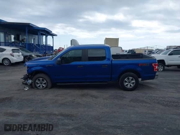 2018 Ford F-150 XL z VIN 1FTEW1EG2JKC55514, wystawiony jako IAAI lot #42889236 z przebiegiem 50 677 mil mil oraz . Historia ofert i sprzedaży dostępna na DreamBid. Obrazek 14.