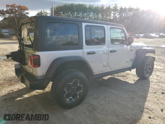 2023 Jeep Wrangler Rubicon with VIN 1C4JJXR61PW630974, listed as a Copart auction lot 90245445 with 57,589 mi miles and Clean title. Bid and sale history available at DreamBid. Image 3.