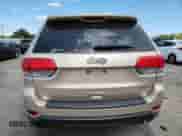 2014 Jeep Grand Cherokee Laredo with VIN 1C4RJEAGXEC185418, listed as a Copart auction lot 69435215 with 207,954 mi miles and Salvage title. Bid and sale history available at DreamBid. Image 6.