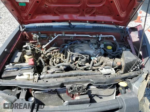 2004 Nissan Frontier XE z VIN 1N6ED29Y74C405630, wystawiony jako Copart lot #55339735 z przebiegiem 201 032 mil mil oraz Szkoda całkowita • Salvage title. Historia ofert i sprzedaży dostępna na DreamBid. Obrazek 11.