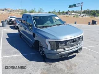 2023 Ford F-150 Lightning Pro with VIN 1FTVW1EL6PWG23367, listed as a IAAI auction lot 43144775 with 9,729 mi miles and . Bid and sale history available at DreamBid. Image 1.