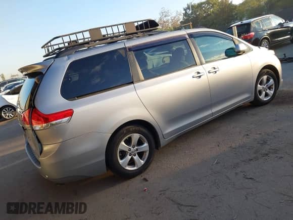 2014 Toyota Sienna LE AAS with VIN 5TDKK3DC0ES457615, listed as a IAAI auction lot 43502655 with 146,897 mi miles and . Bid and sale history available at DreamBid. Image 4.