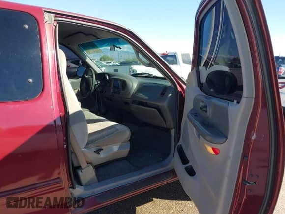 1999 Ford F-150 with VIN 1FTRX17W3XKB03527, listed as a IAAI auction lot 43450405 with 121,752 mi miles and . Bid and sale history available at DreamBid. Image 5.