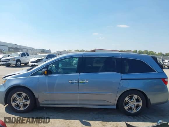 2012 Honda Odyssey Touring with VIN 5FNRL5H97CB130670, listed as a IAAI auction lot 43438076 with 198,047 mi miles and . Bid and sale history available at DreamBid. Image 14.