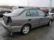 2002 Hyundai Accent GL z VIN KMHCG45C72U269610, wystawiony jako Copart lot #80362953 z przebiegiem 89 481 mil mil oraz Szkoda całkowita • Salvage title. Historia ofert i sprzedaży dostępna na DreamBid. Obrazek 3.