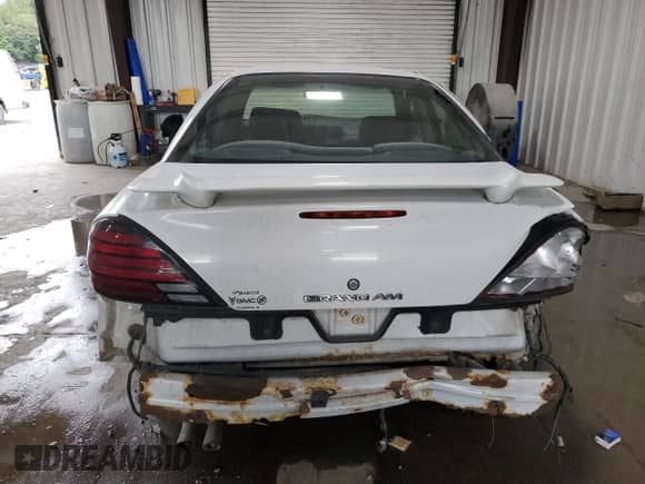 2004 Pontiac Grand Am SE1 with VIN 1G2NF52E84M669999, listed as a Copart auction lot 70597345 with 186,803 mi miles and Salvage title. Bid and sale history available at DreamBid. Image 6.