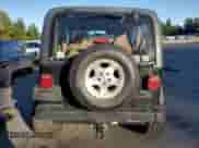 1997 Jeep Wrangler Sahara with VIN 1J4FY49SXVP486730, listed as a Copart auction lot 82473255 with 143,015 mi miles and Salvage title. Bid and sale history available at DreamBid. Image 6.