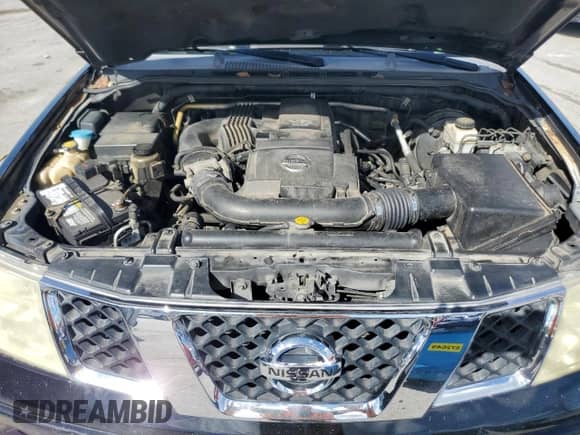 2006 Nissan Frontier SE with VIN 1N6AD07UX6C412495, listed as a Copart auction lot 84879235 with 257,704 mi miles and Salvage title. Bid and sale history available at DreamBid. Image 11.