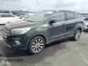 2017 Ford Escape Titanium with VIN 1FMCU0J97HUB04015, listed as a IAAI auction lot 43211466 with 200,577 mi miles and . Bid and sale history available at DreamBid. Image 2.