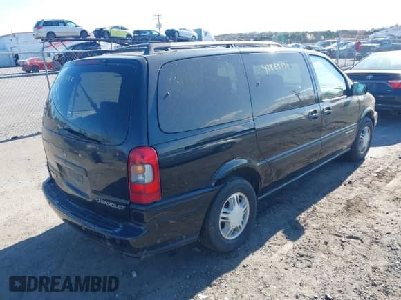 2003 Chevrolet Venture Warner Bros 1SE z VIN 1GNDX13EX3D302359, wystawiony jako IAAI lot #41883432 z przebiegiem 265 868 mil mil oraz . Historia ofert i sprzedaży dostępna na DreamBid. Obrazek 4.