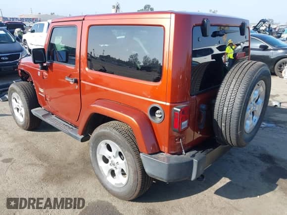 2014 Jeep Wrangler Sahara with VIN 1C4AJWBG4EL158586, listed as a IAAI auction lot 43220489 with 36,662 mi miles and . Bid and sale history available at DreamBid. Image 3.