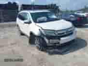 2019 Honda Pilot Touring 8-Passenger z VIN 5FNYF5H9XKB001842, wystawiony jako IAAI lot #43026784 z przebiegiem 114 674 mil mil oraz . Historia ofert i sprzedaży dostępna na DreamBid. Obrazek 1.