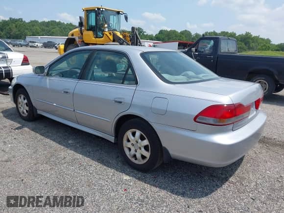 2002 Honda Accord EX with VIN 1HGCG56642A076174, listed as a IAAI auction lot 42819951 with 165,539 mi miles and . Bid and sale history available at DreamBid. Image 3.